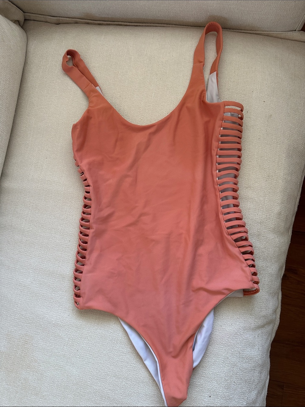 Nookie Women One-Piece reversible Swimsuit in Coral with Side Ladder Cutouts